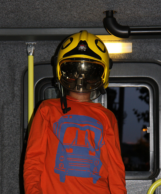 Alasdair Tries On A Firefighter's Helmet
