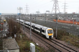 Dagenham Dock in the rain - fords tanks in the distance, bus station and the A13 to the right