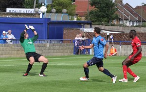 Ahmet chips the ball over McEntegart.
