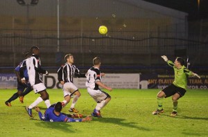 Ahmet toe-pokes the ball into Leon's path