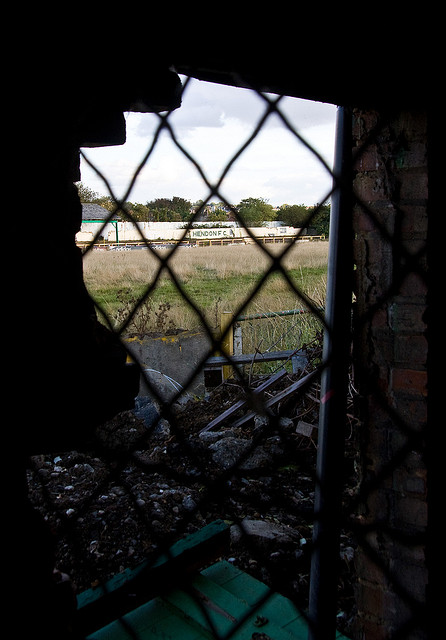 Claremont Road viewed through a turnstile grill