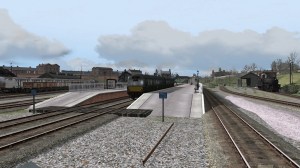 Castle Douglas Station with a Metropolitan-Cammell diesel unit waiting to depart and a Black 5 locomotive standing outside the small loco depot