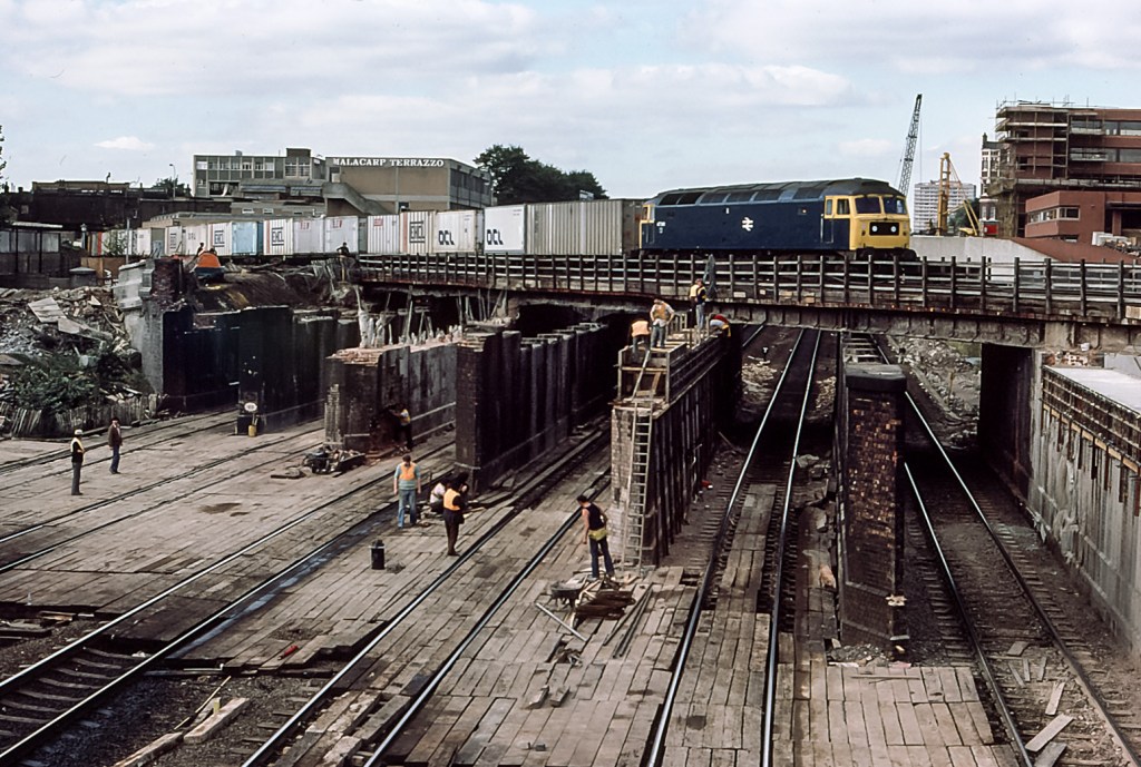 Bridge rebuilding at West Hampstead - An intermodal service on the North London Line crosses the Midland Mainline.